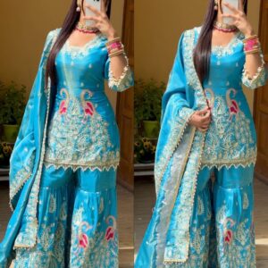 Elegant sky blue sharara set adorned with intricate embroidery, featuring a flared silhouette and delicate embellishments, perfect for festive occasions or weddings